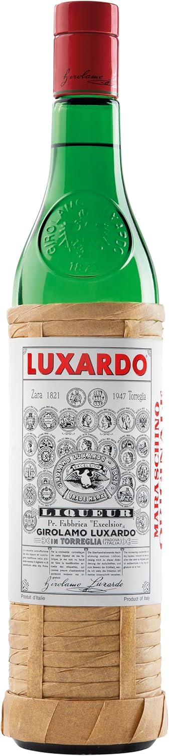 A bottle of Luxardo Limoncello liqueur, featuring a green glass bottle with a red foil top and a beige bamboo sleeve wrapped around the middle and bottom.